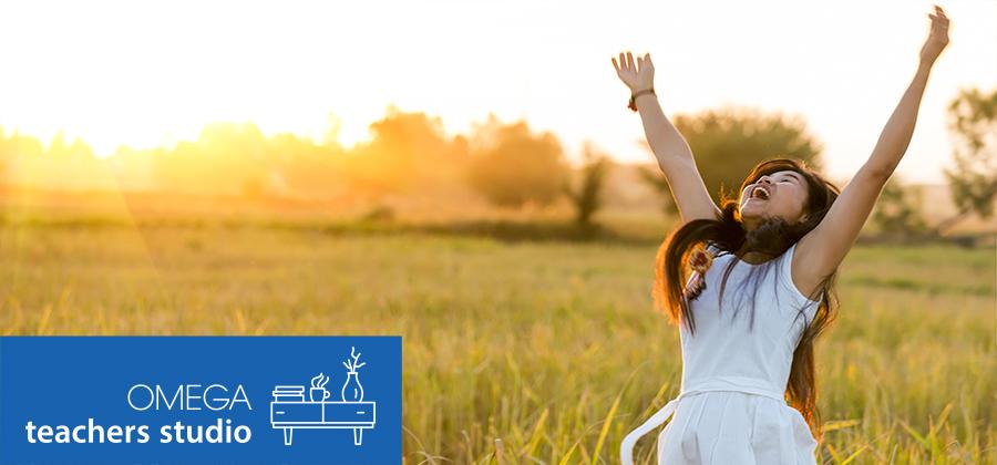 Woman standing joyfully in a field