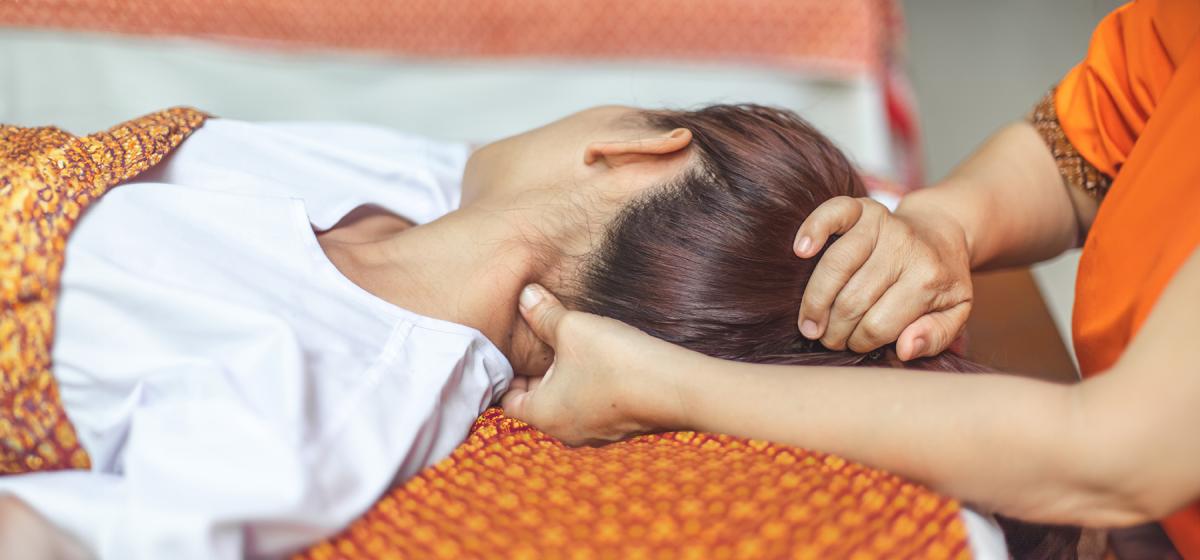 Person receiving an acupressure treatment