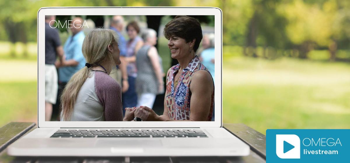 Suzanne Giesemann talking to an Omega participant on laptop with Omega livestream logo