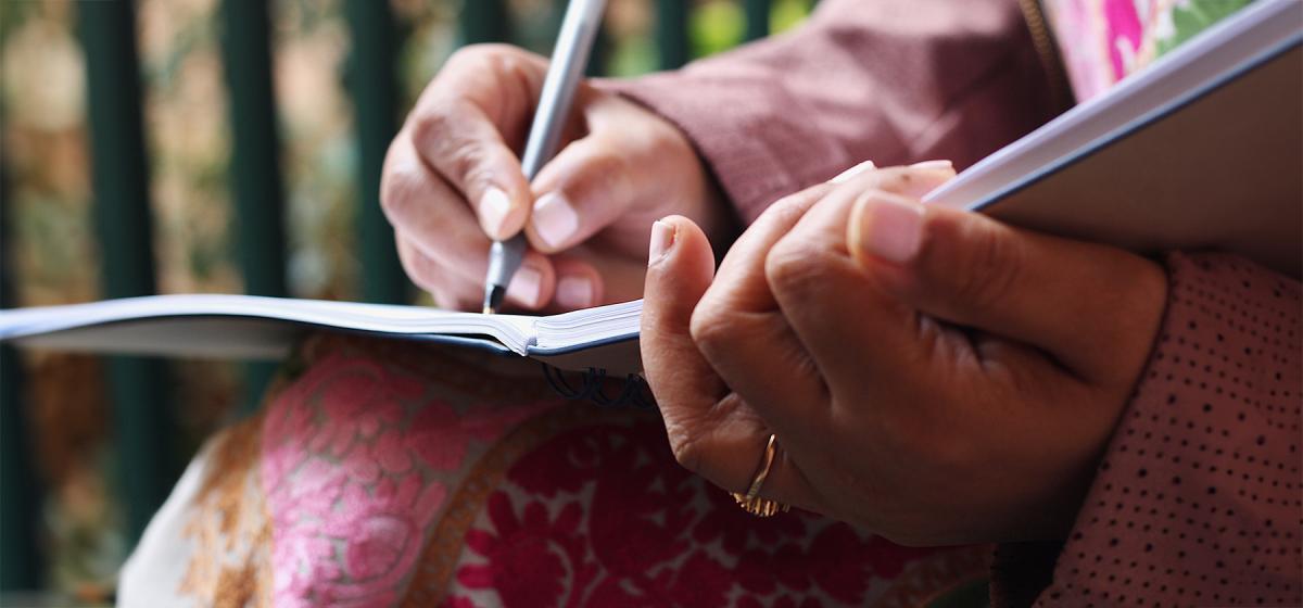 Person writing in a journal