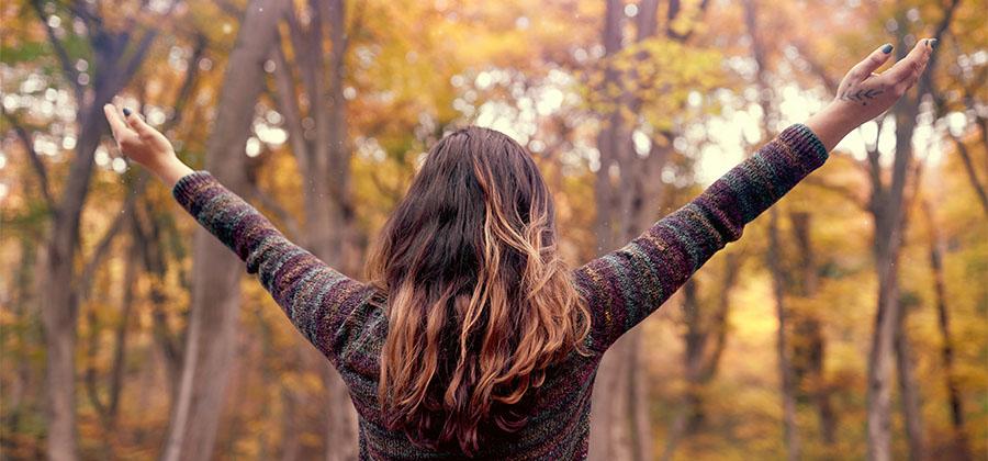 Woman with arms raised