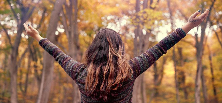 Woman with arms raised