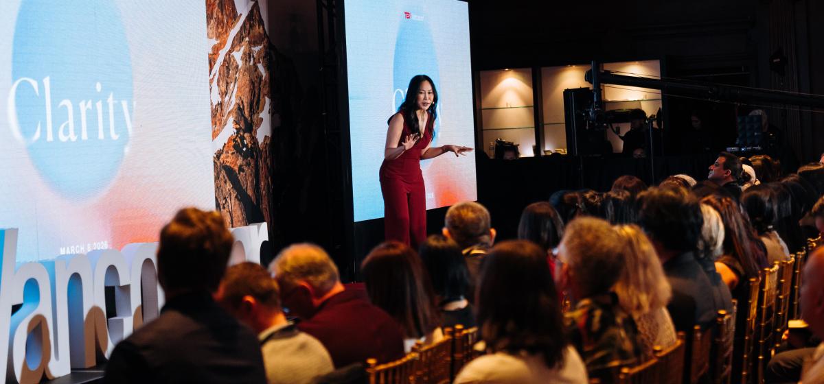 Amy Chan speaking at a TEDx event.