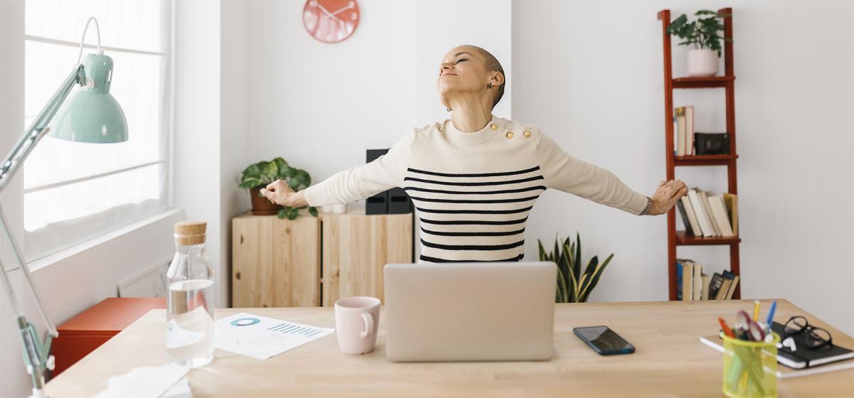 Person stretching in office
