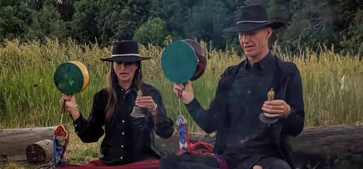 Charlotte Rotterdam and Pieter Oosthuizen leading a meditation practice outdoors