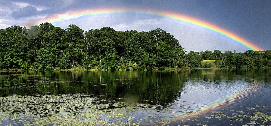 Rainbow over the lake at Omega