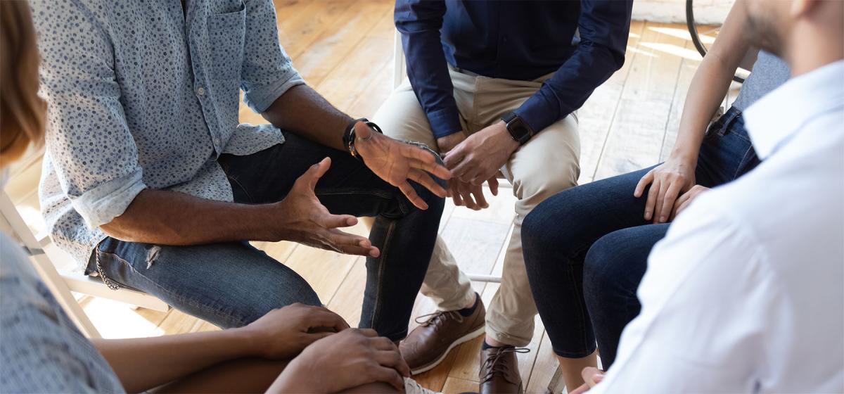 Group of people in a story sharing circle
