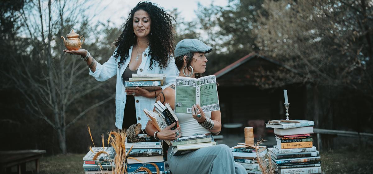Lydia Viole Harutoonian and Leah Song outside surrounded by books and sacred objects