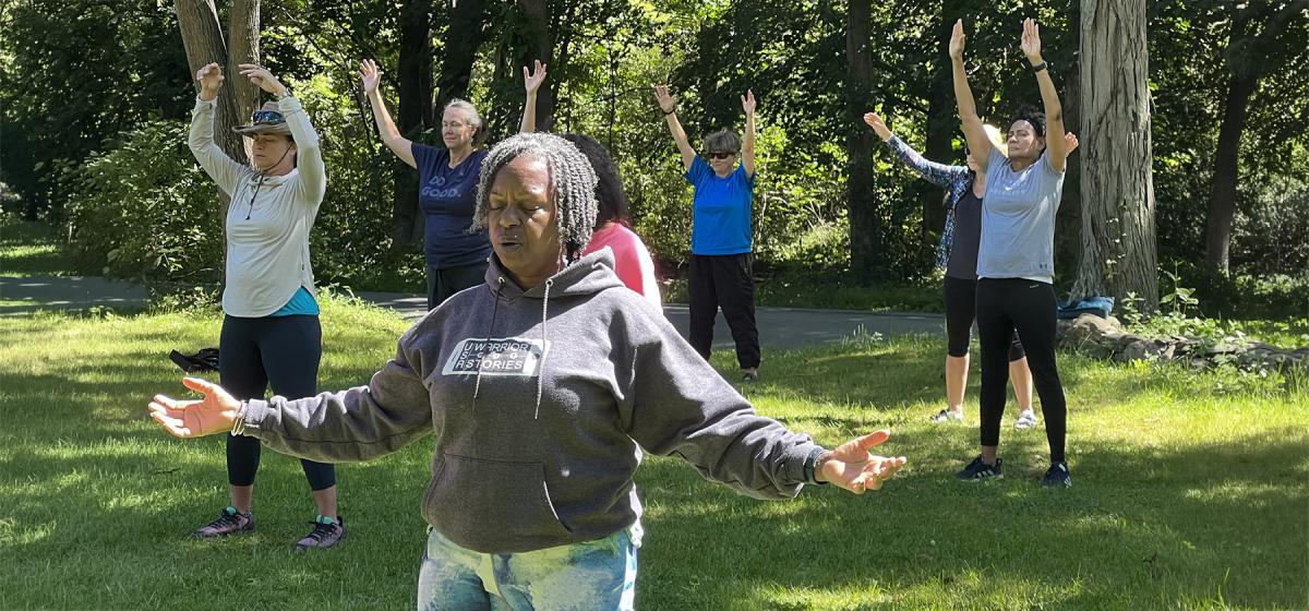 Group of veterans in outdoor yoga class