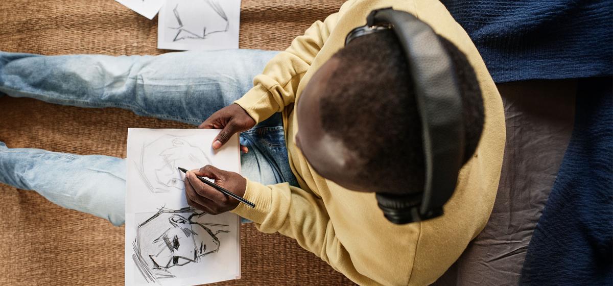 Person drawing cartoons