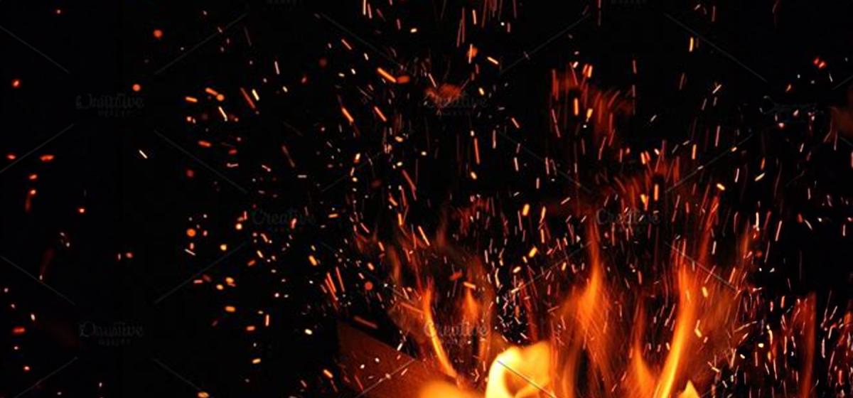 Flame and sparks against a dark background