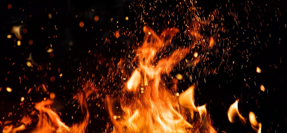 Flames with sparks on a dark background