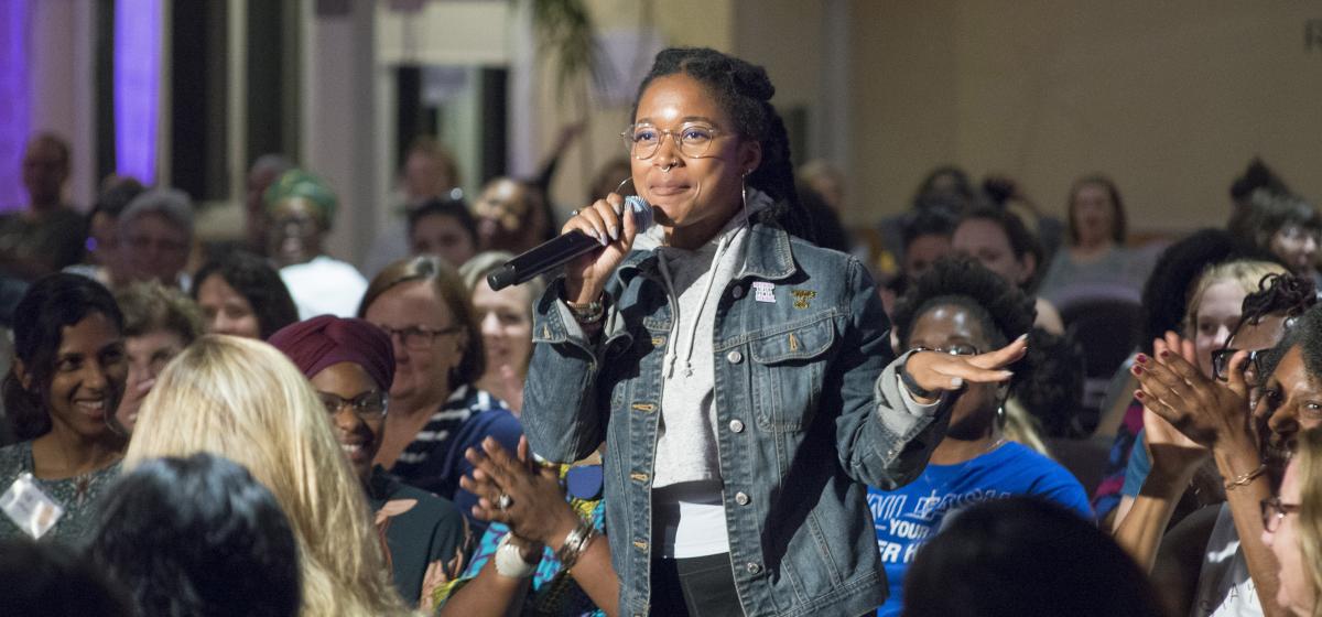 Participant speaking at a past Women & Power conference