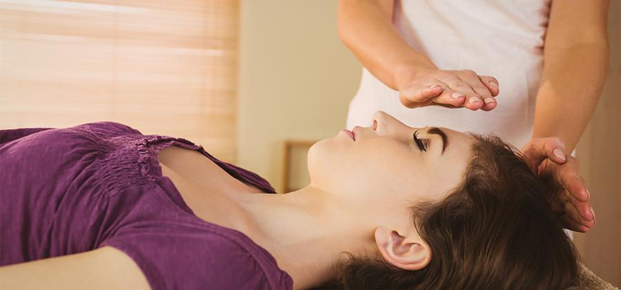 Woman receiving a reiki treatment