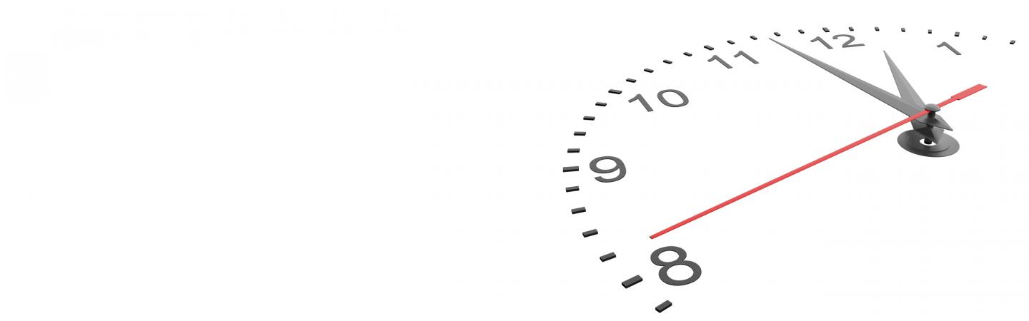 Close-up of a minimalist wall clock showing time passing, symbolizing slowing down, mindfulness, and being present in daily life.