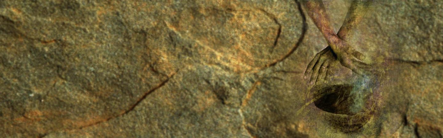 Abstract image of hands over a healing bowl blended with rock textures, representing ancient spiritual practices and the root causes of soul illness such as disharmony, fear, and soul loss.