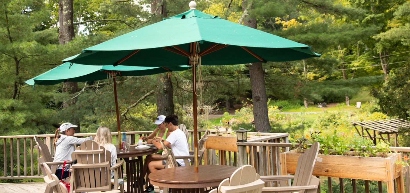 People dining on the Omega Cafe sun deck