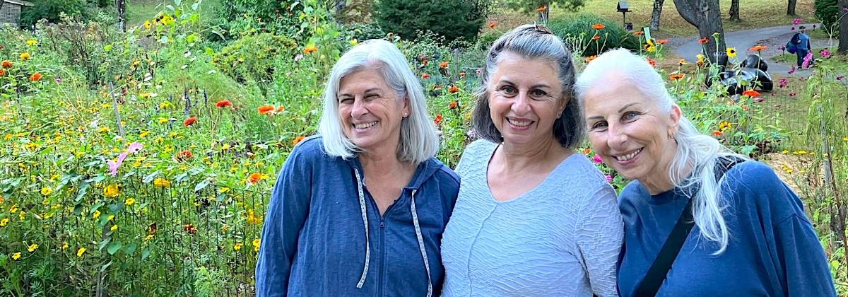 Theresa, left to right, Paula, and Mary Simon enjoy the gardens at Omega during their annual visits.