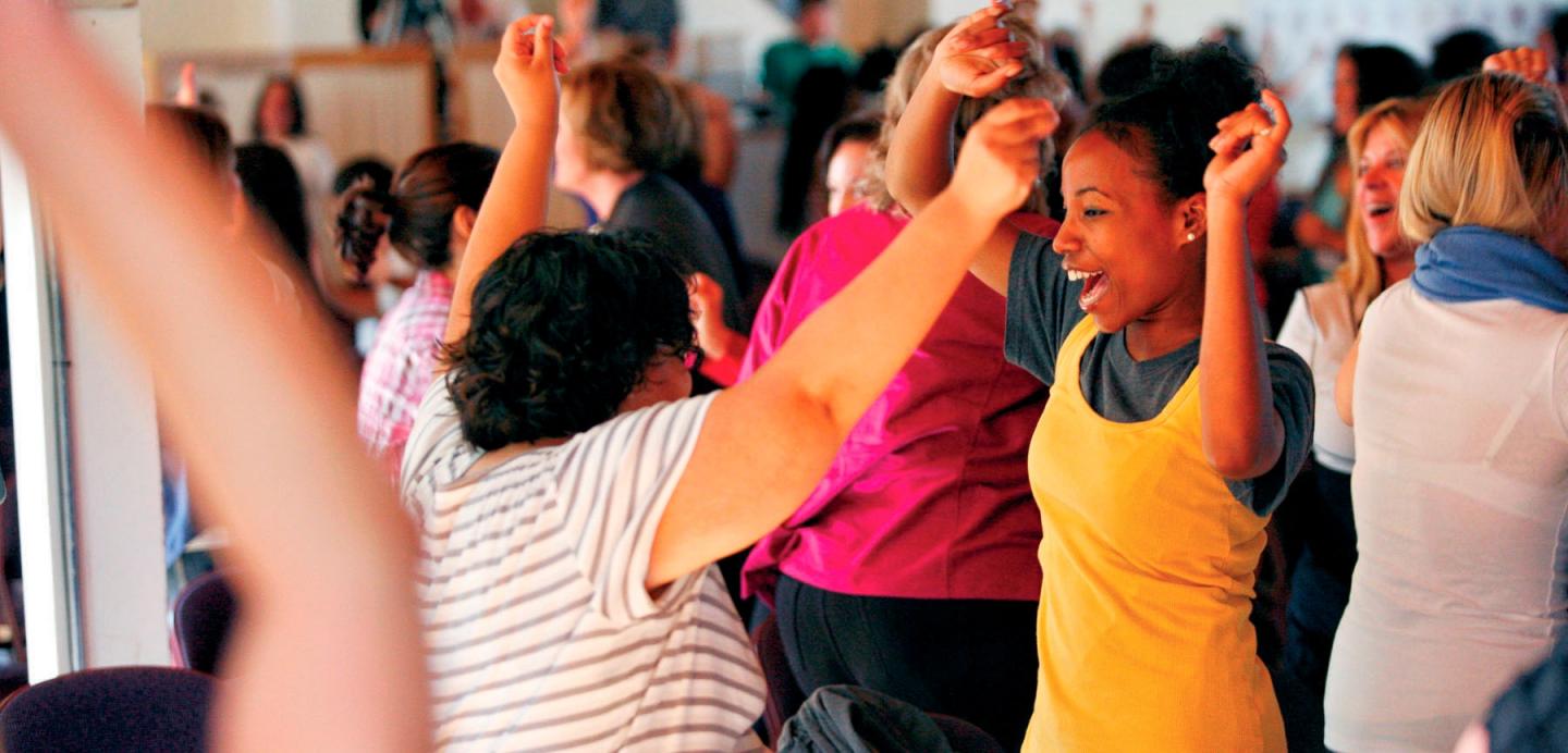 Participants dancing at an Omega workshop