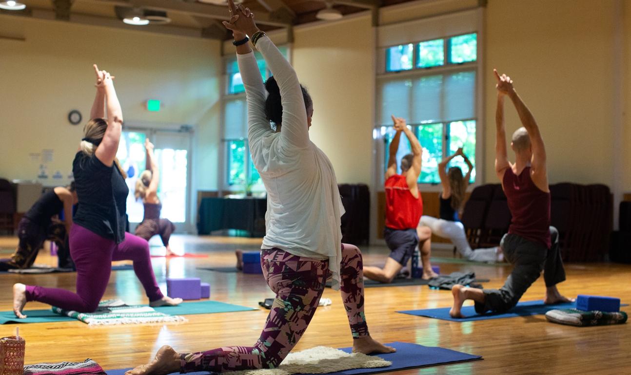 Women practicing yoga at a yoga retreat at Omega Institute.