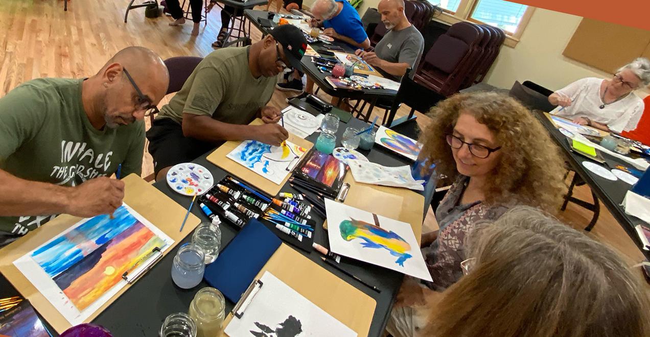 Group of people around a table, painting