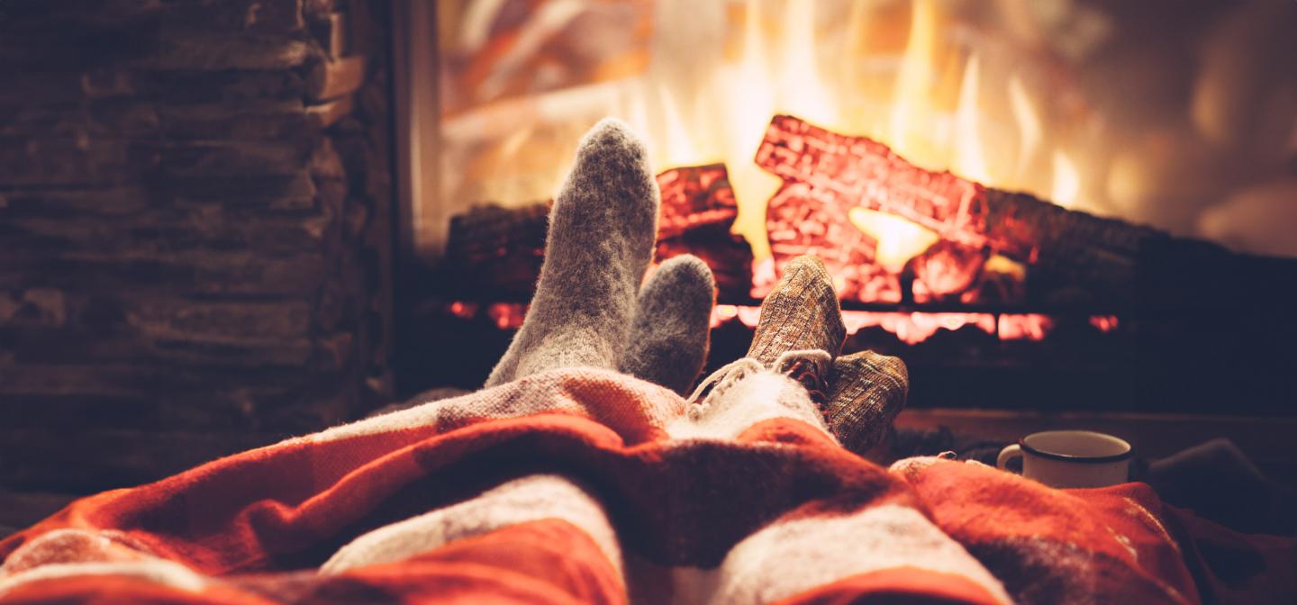 Sitting in front of a fire wearing cozy socks