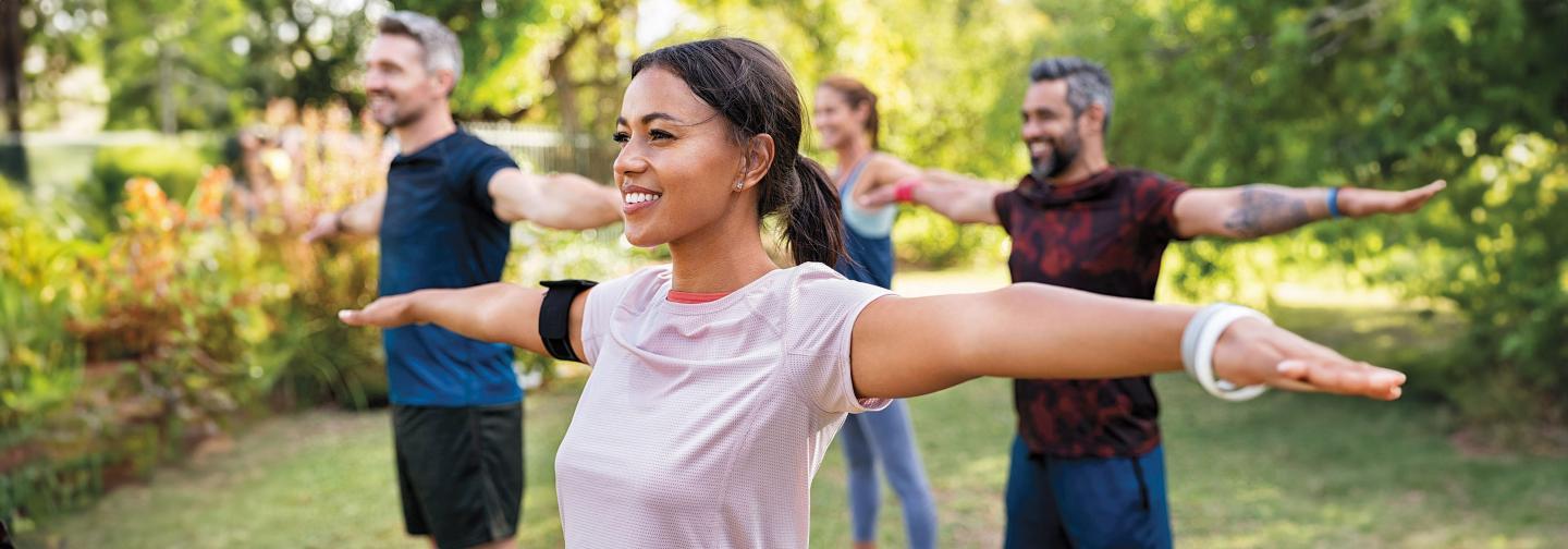 Group of people in yoga class outside