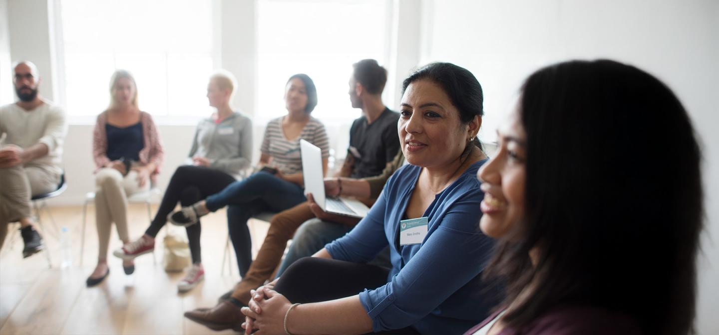 Group of healing practitioners in a professional training workshop.