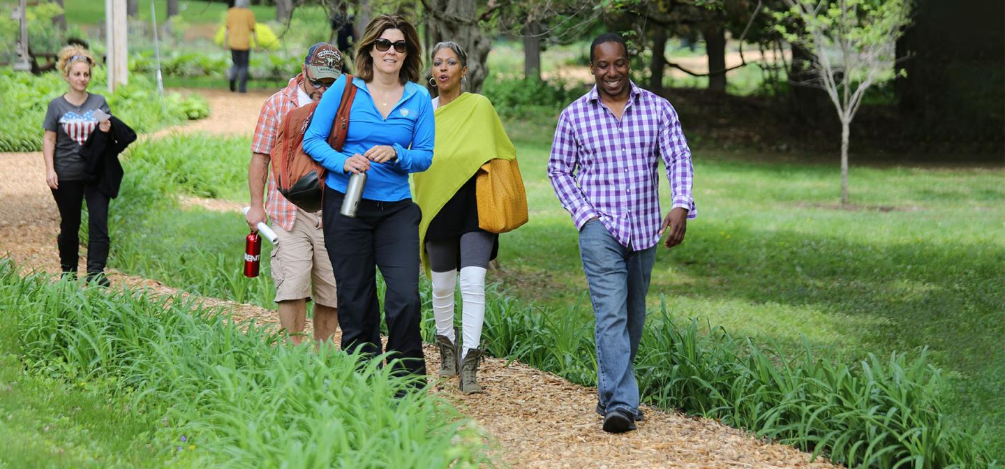 People walking on campus at Omega