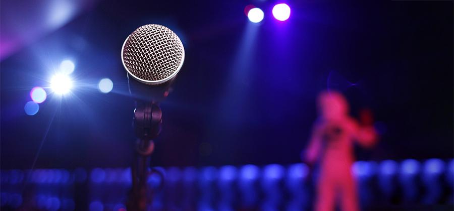 Microphone in front of a dark stage