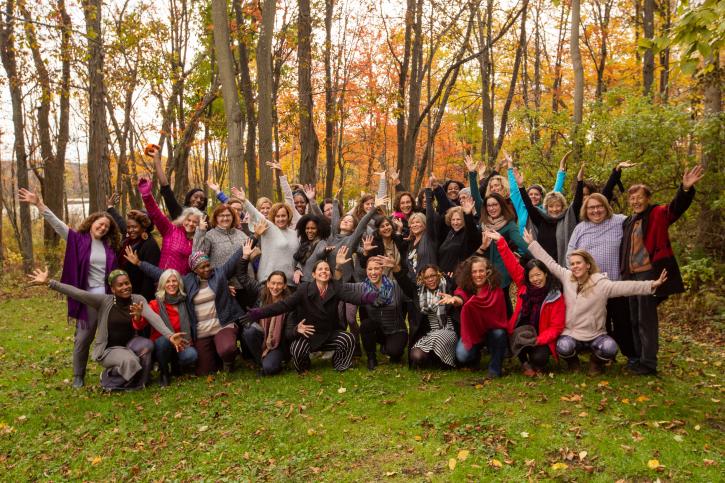 OWLC participants and faculty looking happy together in autumn woods.